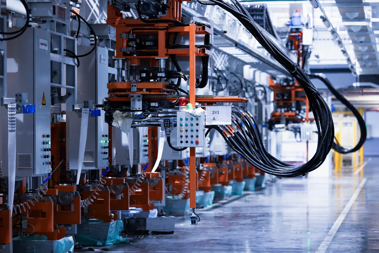 A line of electrical equipment on a factory floor